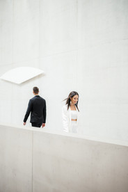 Bride and Groom on their wedding session in modern building with editorial style.