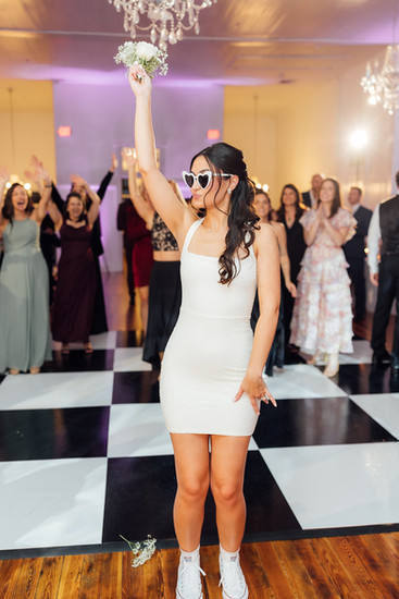 Bouquet Toss ! Bride about to toss her bouquet in the stunning ballroom