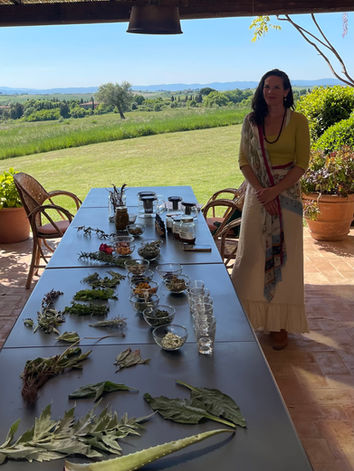 Jordana guiding a herbalism class in Tuscany at L'Oliveto