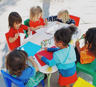 preschoolers Drawing pictures on a table