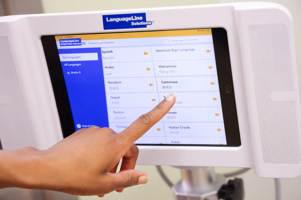 Person pointing to a monitor