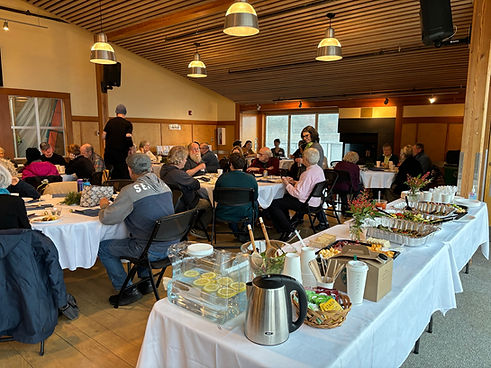 02.23.2025_Volunteer Appreciation Party_crowd 4 and food.jpeg