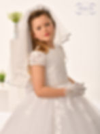 girl wearing a communion dress