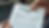 Close-up view of a hand holding a denied insurance claim letter
