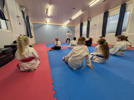 Children practising focus and listening skills in a structured karate class at Soaring Eagle Karate in Keighley