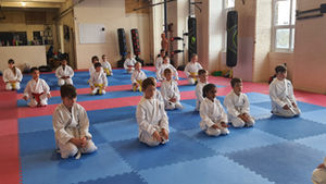 Children practising discipline and focus in a structured kids karate class at Soaring Eagle Karate in Keighley