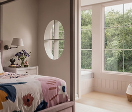 Custom millwork includes wall planking, day bed, window casing and peek-a-boo window