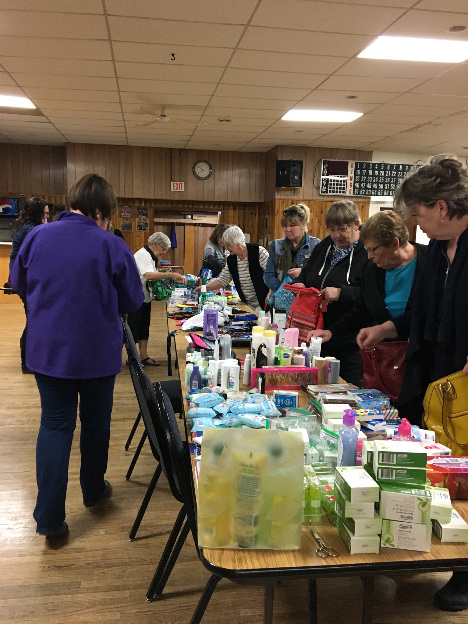 Volunteers filling handbags