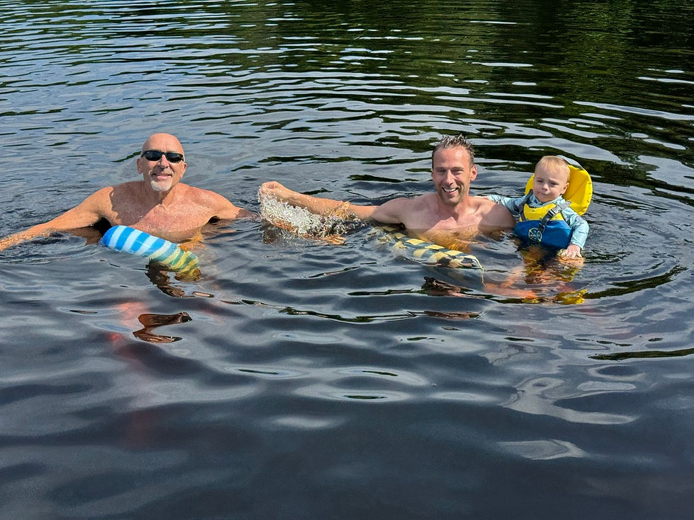 Three generations relishing a refreshing swim after soaking up the sun on the pontoon.