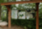 Signage at Milford Mine Memorial Park provides visitors with trail maps, park information, and historical context, all surrounded by lush greenery.