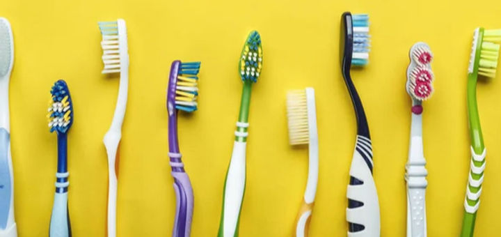 depositphotos_315549824-stock-photo-different-toothbrushes-on-a-bright_edited.jpg