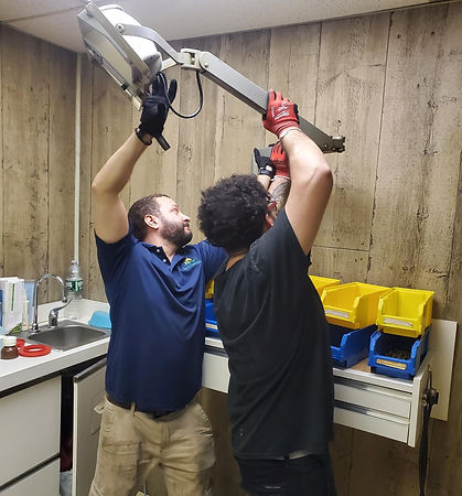 two of our team members removing some dental equipment in Brooklyn Heights