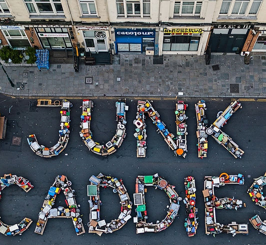 pile of junk aranged in the letter "Junk Caddies" image generate by AI