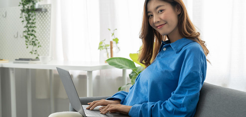 young-asian-business-woman-smile-and-work-from-home-with-laptop-computer-online-to-interne