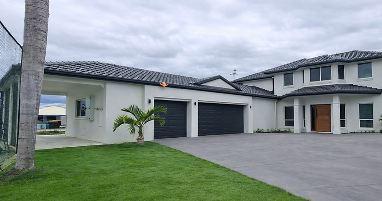 Freshly painted Surfmist coloured cement render walls, Monument terracotta tile roof. Bright green grass along side tennis court & grey driveway
