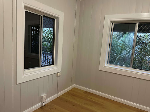 Interior room in Wynnum showcasing meticulous preparation and premium interior painting on VJ panelling and window trims by the expert team at JT Industries & Co.