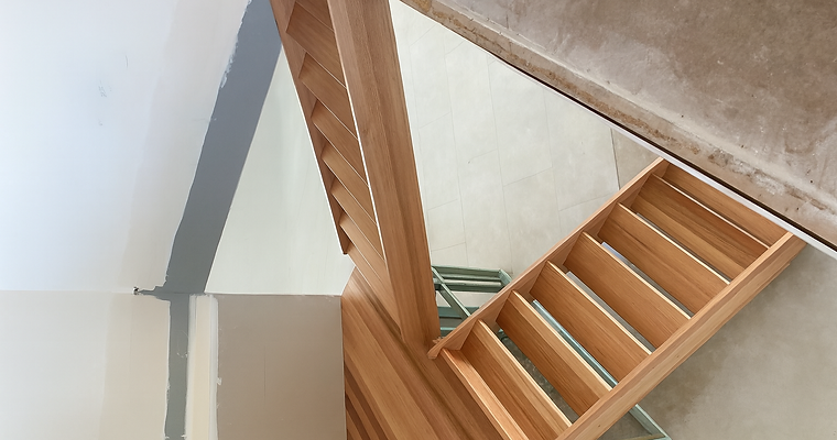 Timber staircase and landing with a clear varnish over the all the timber work.