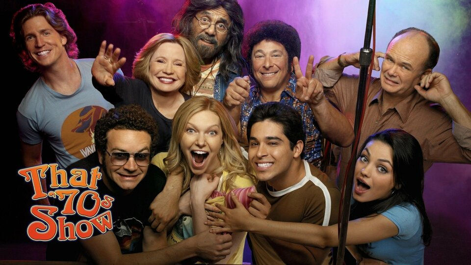 Cast of That 70's Show pose for a studio promotion image.