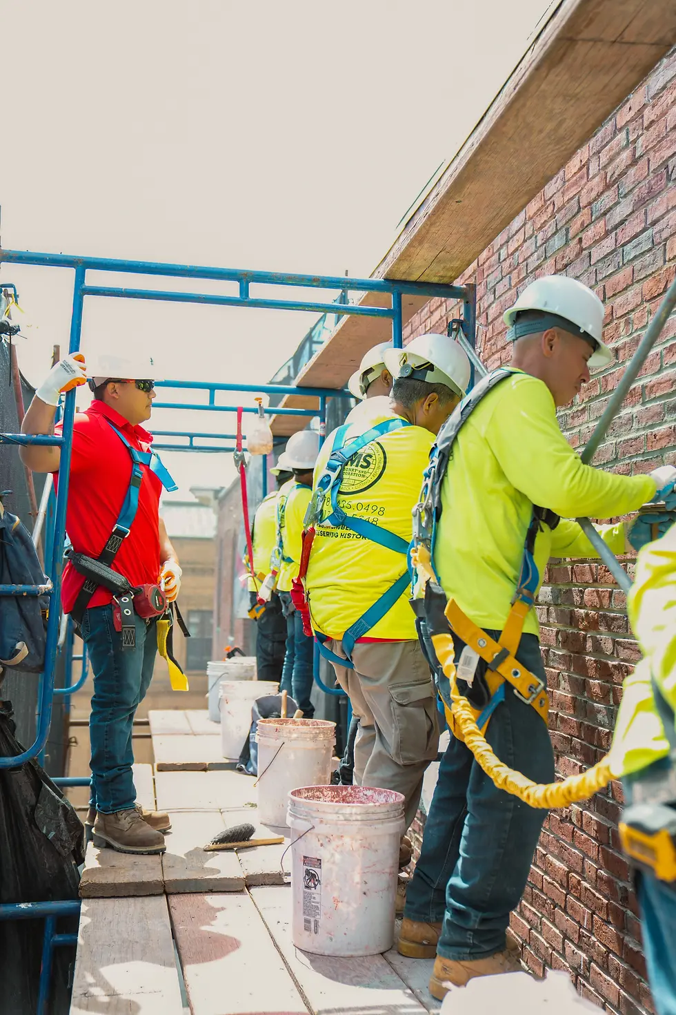 JMS team members applying mortar