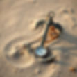 anchor and compass in the sand.jpg