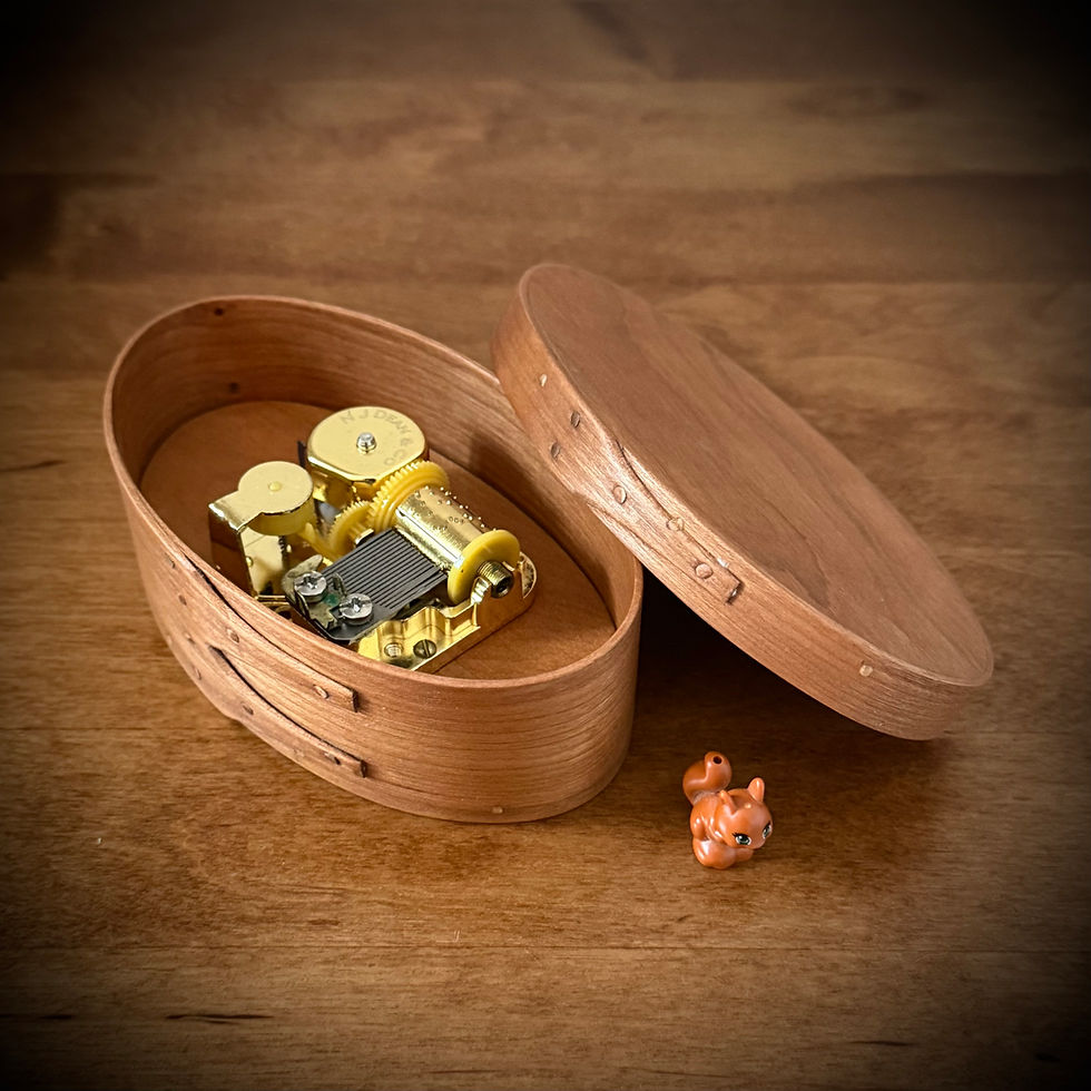 Thumbnail: Cherry Shaker Oval Wooden Music Box Size 1
