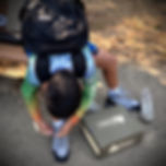 youth-preparing-hiking-boots-after-school-field-trips-equipment