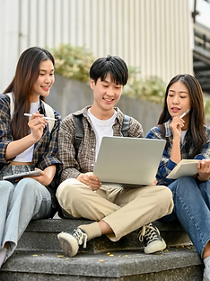 Group of happy young Asian college students sitting on stairs in front.png