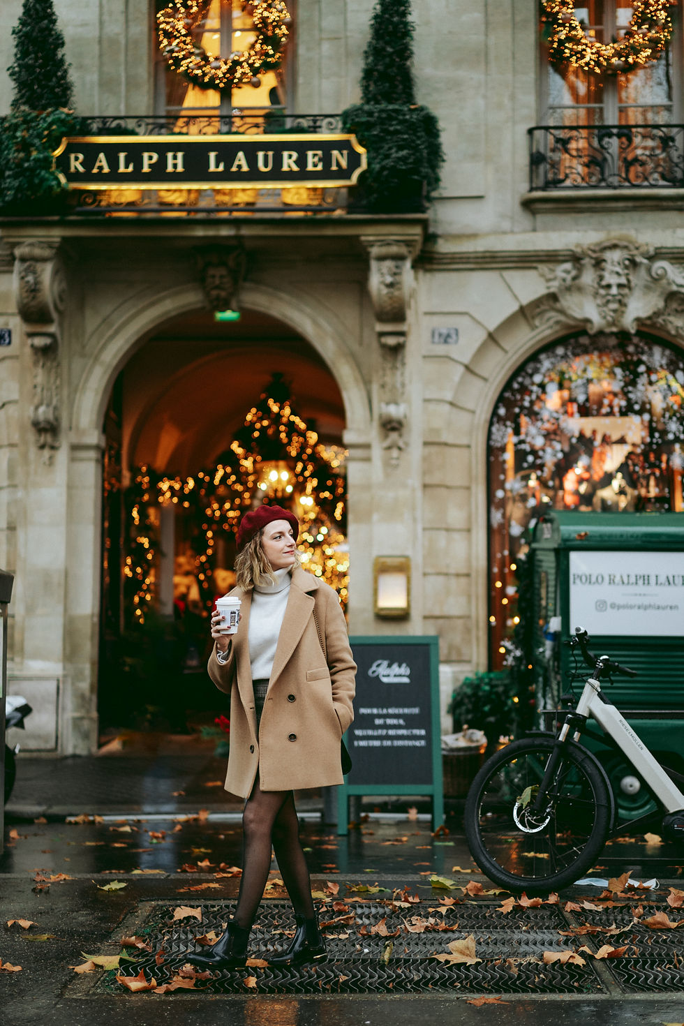 Woman enjoying Paris Christmas lights