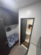 Compact sleeping nook and bathroom in a 1 bedroom condo Tagaytay