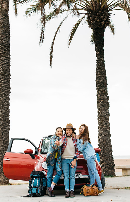 happy-people-taking-selfie-near-red-car.jpg
