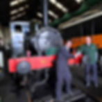 Táilte Tours' David Walsh hands over a contribution towards the restoration campaign for GSWR steam engine No.90.