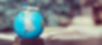 plane%20toy%20over%20a%20world%20globe_edited.jpg