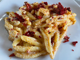 Fresh pasta with ricotta cheese and crumbles of peperone crusco