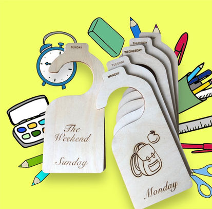 Wooden hanging wardrobe organiser tabs are pictured showing each day name on a hangar, accompanied by an image. For example "Monday" is shown with a school bag engraved onto the hangar by sweet pea laser boutique