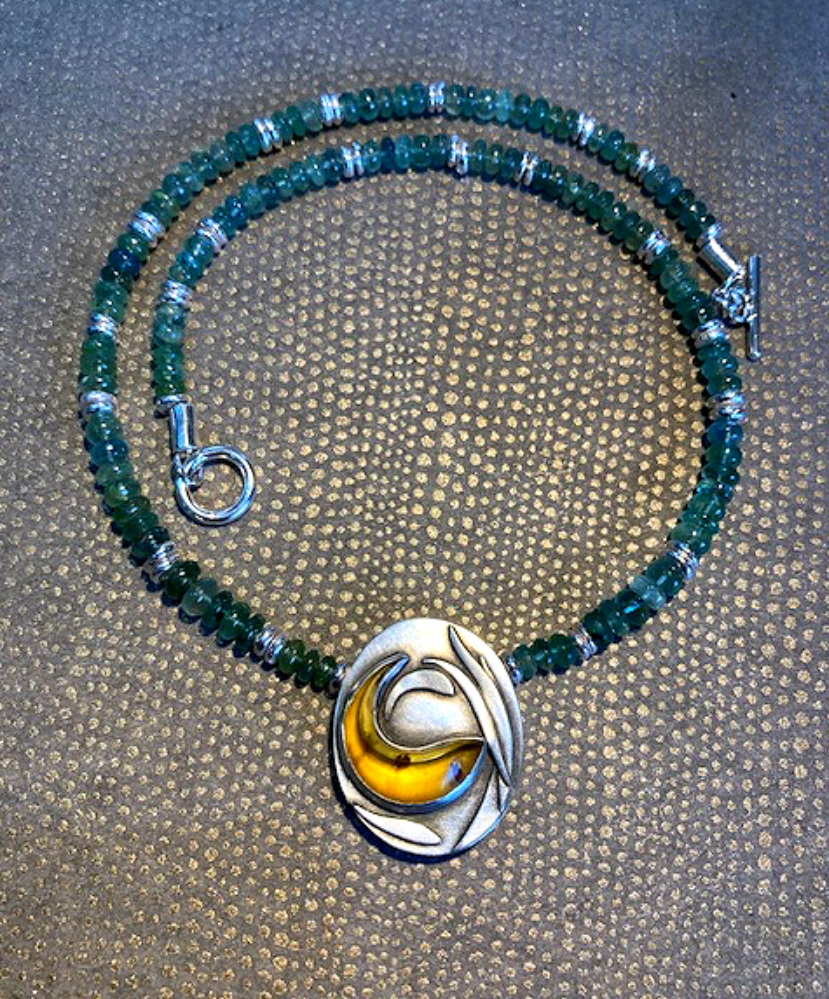 Carved Amber fish necklace.