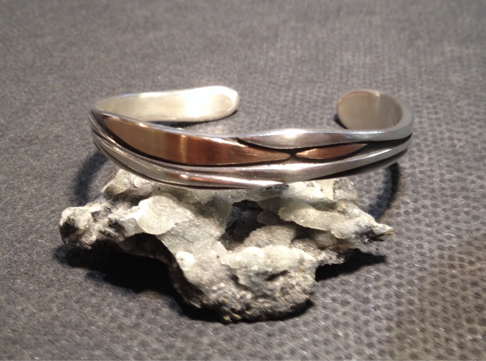 Sterling silver and 18ct rose gold cuff.