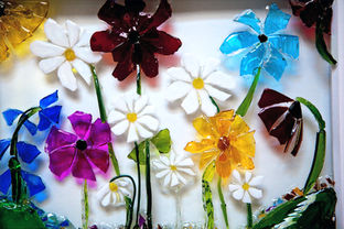 
Framed wild flowers made of broken Gin, Vodka & Wine bottles
