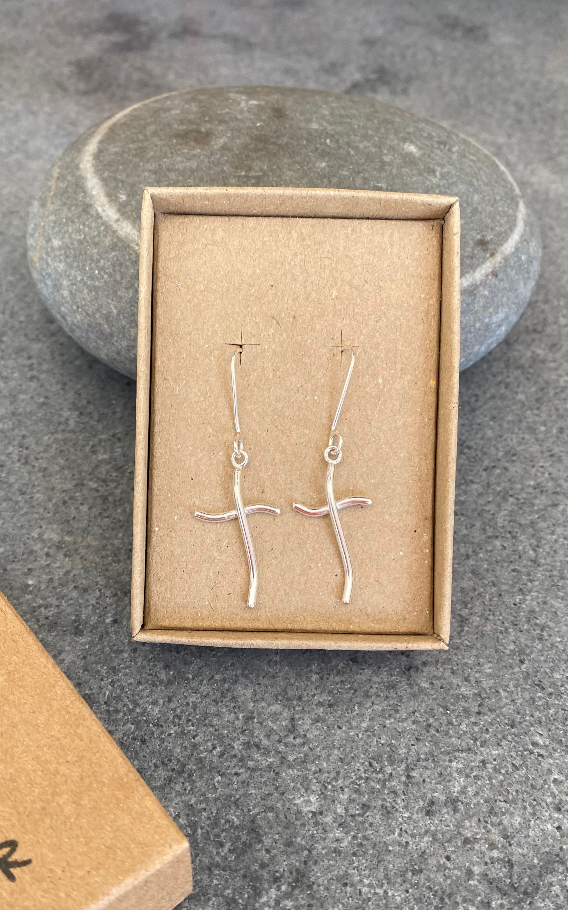 Wobbly cross dangles 