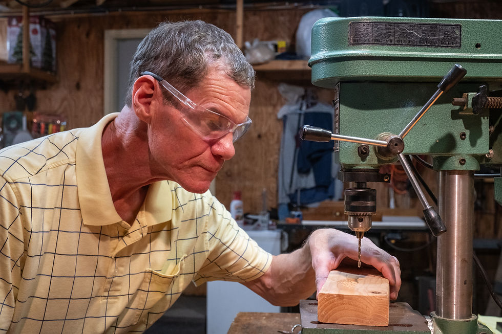 Buddy using the drill press in his workshop, 2025