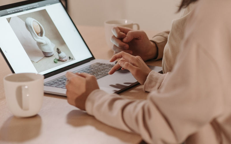 editing a photo on a laptop