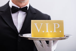 Close-up Of A Waiter Showing Vip Text Ba
