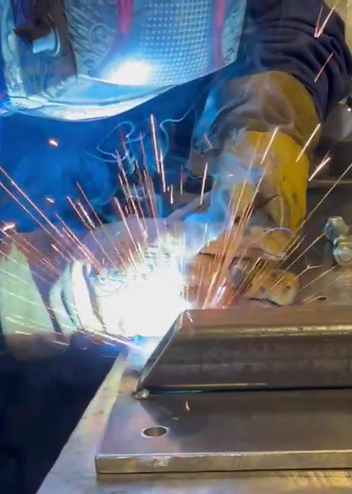 ESI employee welding a metal fabrication in the Pinedale Wyoming shop