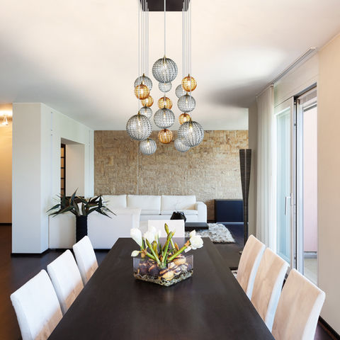 Glass Globe Pendants over dining room low ceiling fixture.