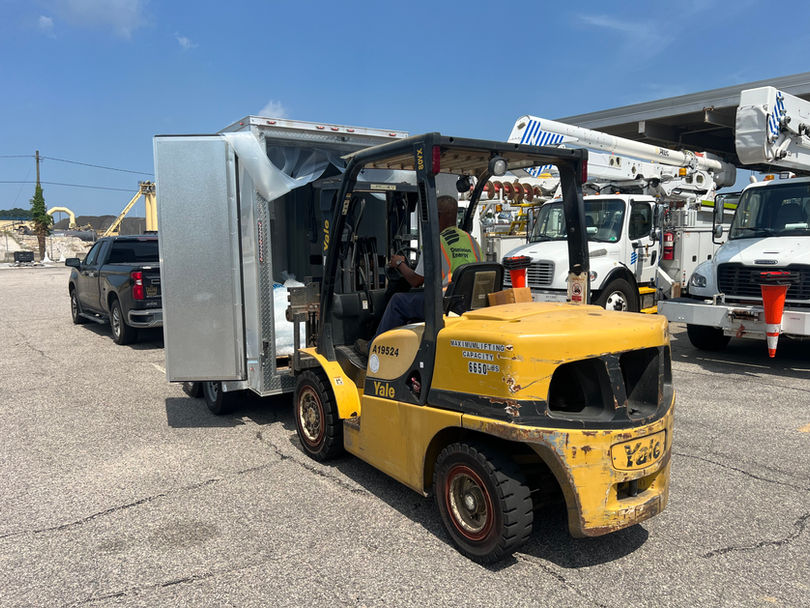 Pallet of Bagged Ice Delivered to Dominion Energy Being Unloaded by a Forklift
