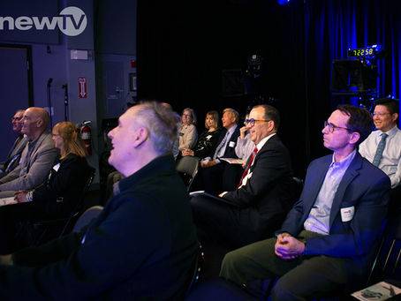 An audience smiling and laughing.