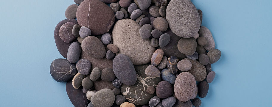 a pile of rocks sitting on top of a blue surface_edited.jpg