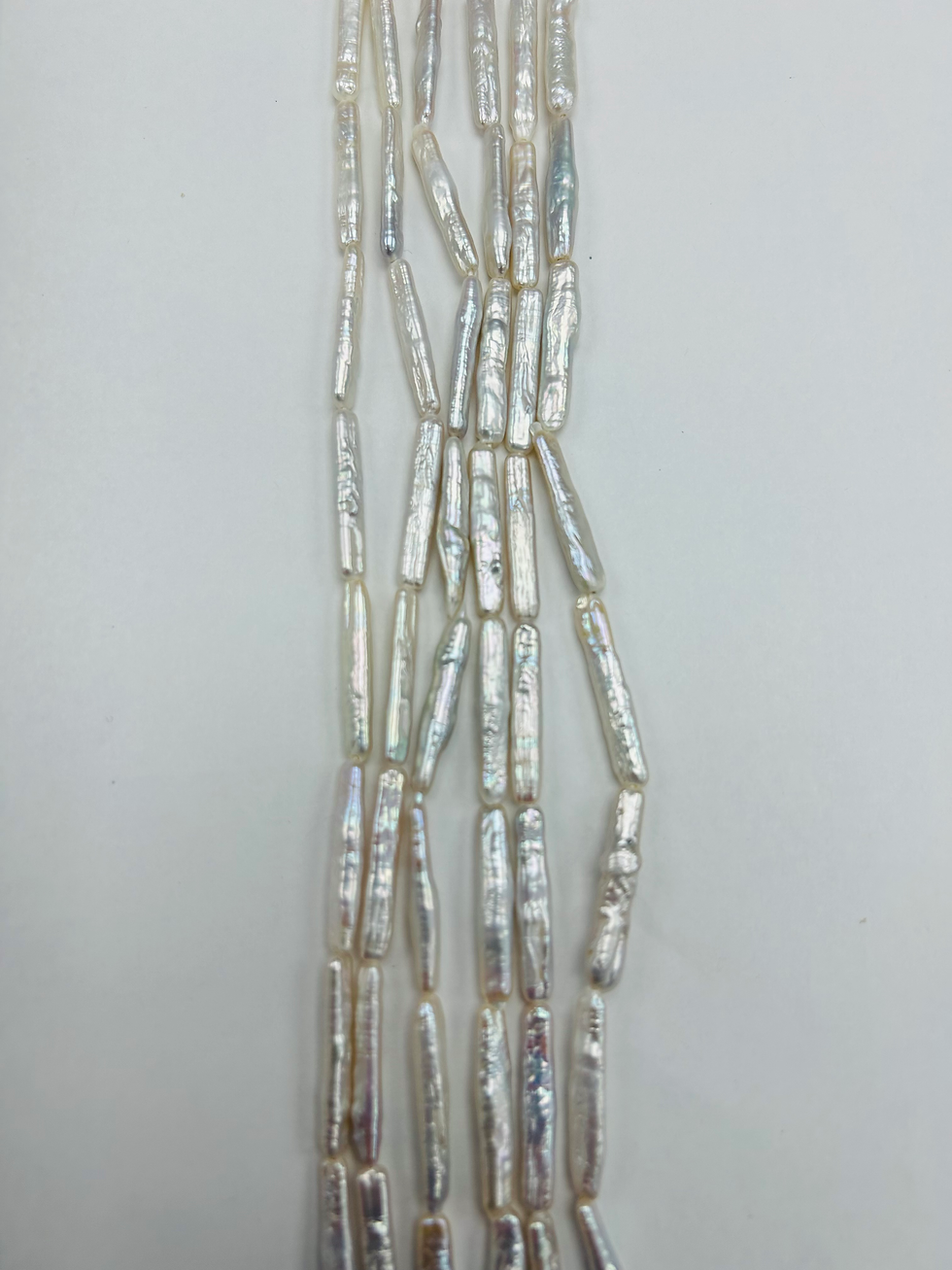 Thumbnail: AAA Grade Freshwater White Stick Keshi Pearls 20" Strand (25mmx7mm, 25mmx3mm)