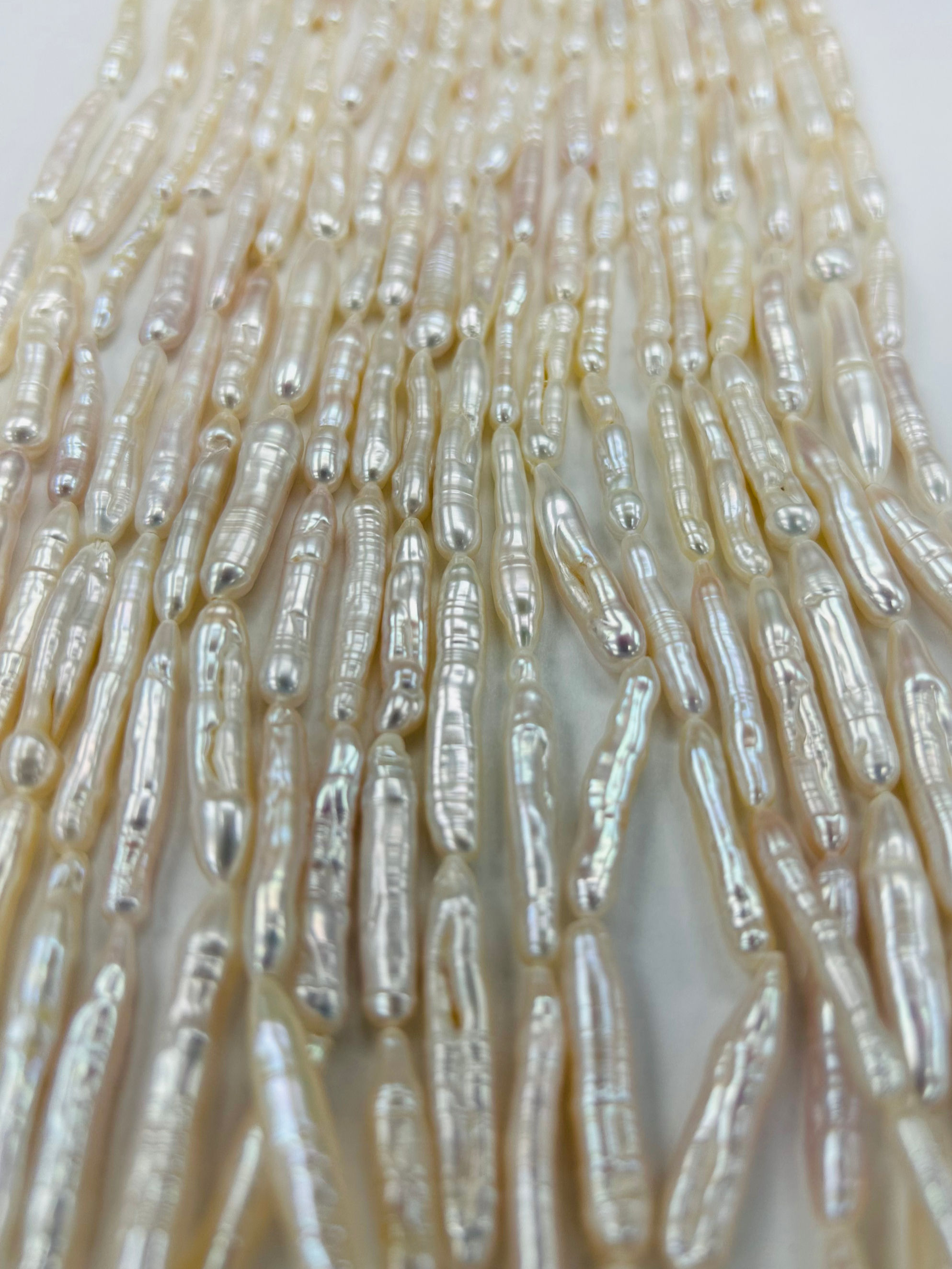 AAA Grade Freshwater Whitish-Pink Stick Keshi Pearls 20" Strand (25mmx3mm)