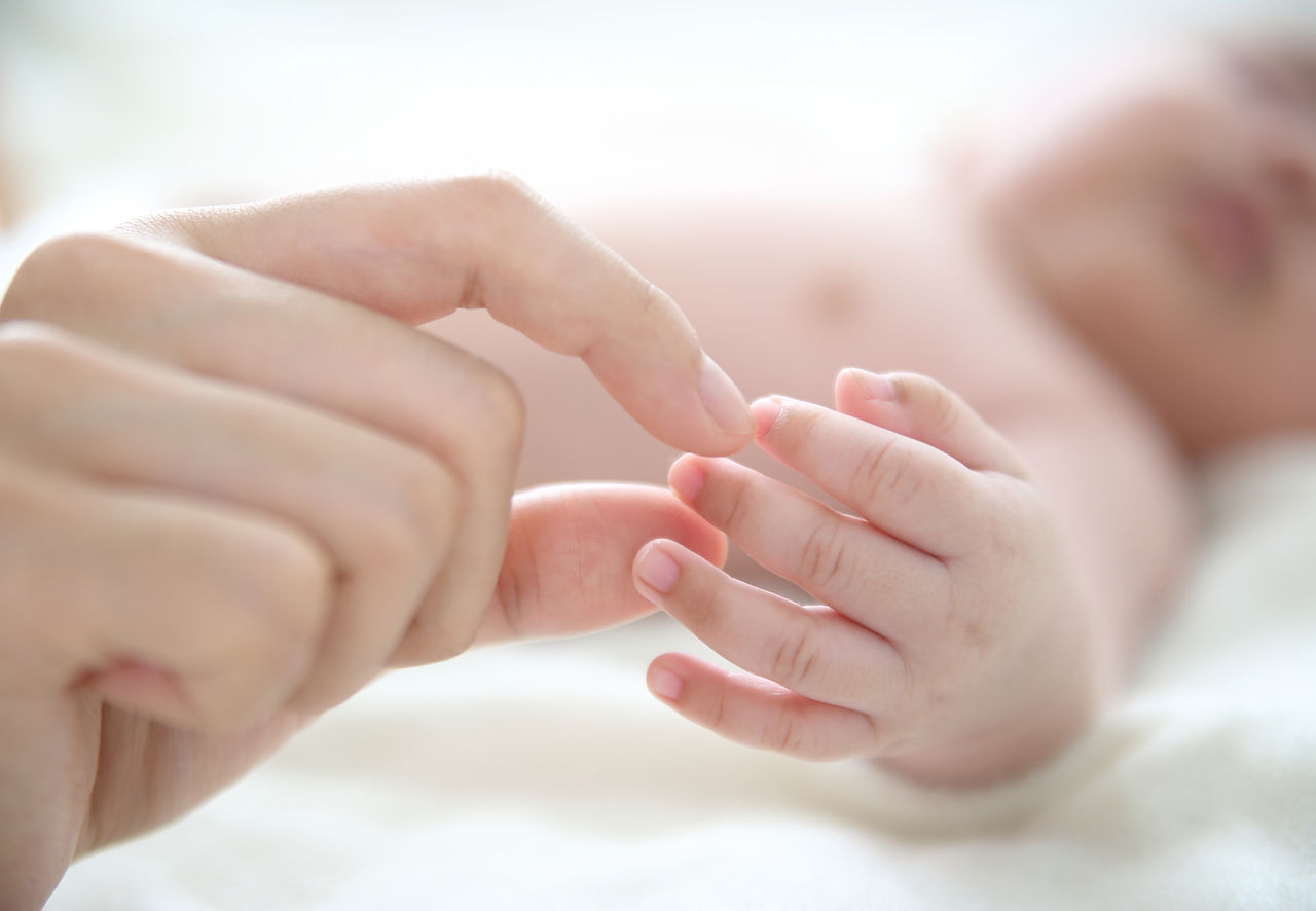 Mother Holding Baby Finger
