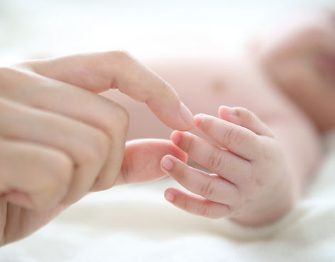 Mother Holding Baby Finger